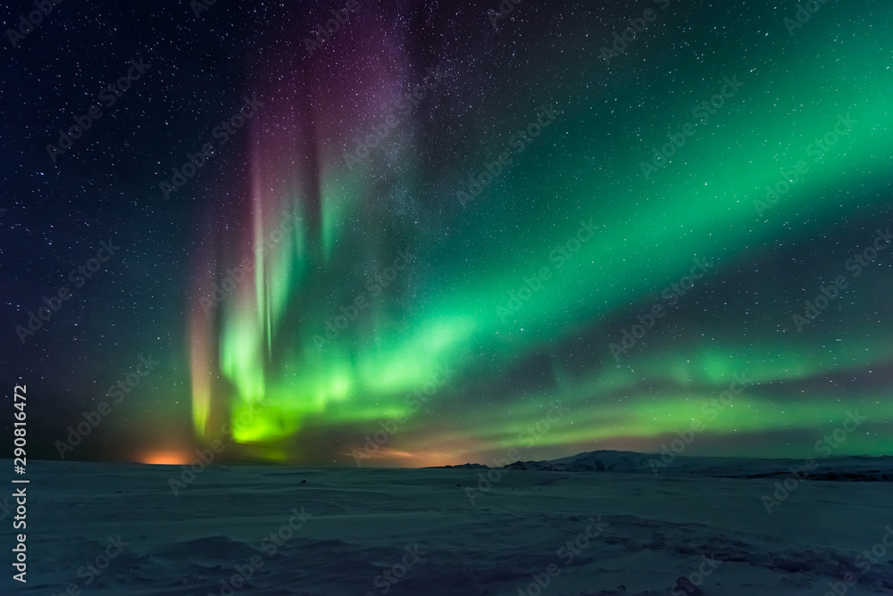 Northern lights aurora borealis in the winter 