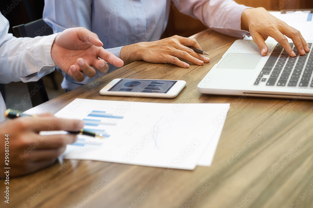 Fototapeta premium Business team brainstorming and discussing with financial data and report graph. Teamwork meeting working concept.