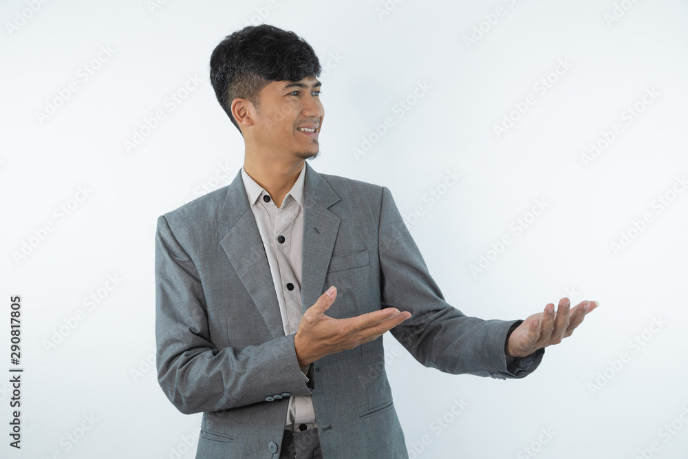 Business asian man showing something on the palm of his hand on white isolated background Business asian man showing something on the palm of his hand on white isolated background