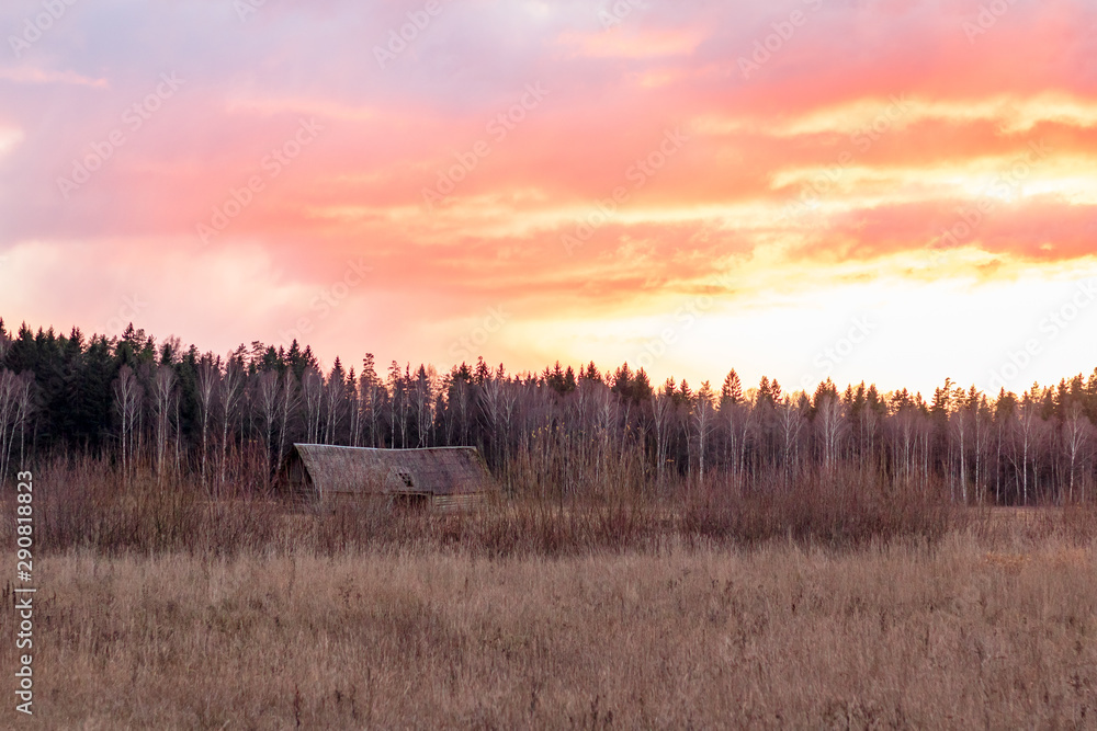 Lonely old barn in a sunset in countryside in November in Latvia