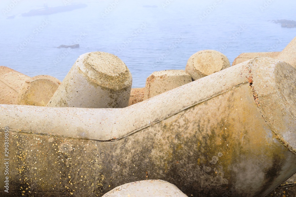 Tetrapod breakwaters in beach sea water Tetrapod breakwaters in beach sea water