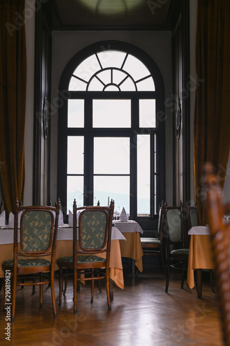 Interior of a classic restaurant in an old castle. Traveling in Europe. Served tables and antiquity.
