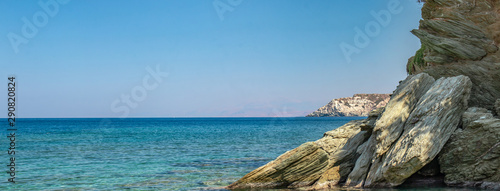 Wallpaper Mural HD wallpaper. Panorama with view a beautiful stone huge cliff and the sea in the background. Stones in the beautiful blue sea. Wildlife on the island of Crete. Torontodigital.ca