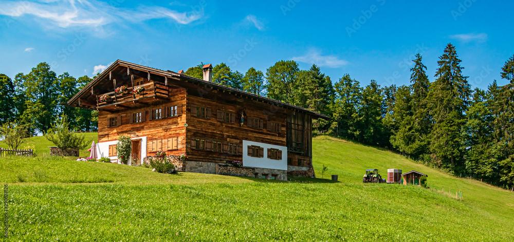Beautiful alpine view with a wooden house at Oberstdorf, Bavaria, Germany Beautiful alpine view with a wooden house at Oberstdorf, Bavaria, Germany