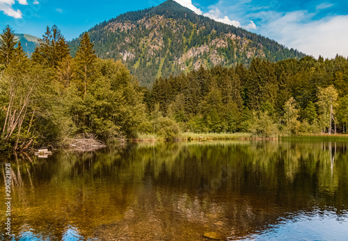 Beautiful alpine view with a lake with mountain reflections at Oberstdorf  Bavaria  Germany