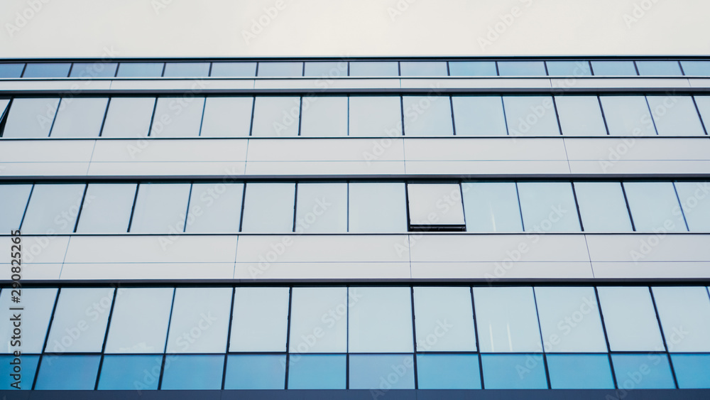 Perspective and underside angle view to textured background of contemporary glass building Perspective and underside angle view to textured background of contemporary glass building
