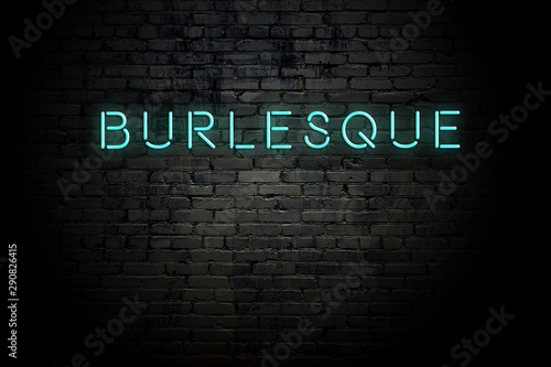 Highlighted brick wall with neon inscription burlesque photo