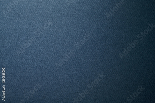 Dark natural paper background. Close-up