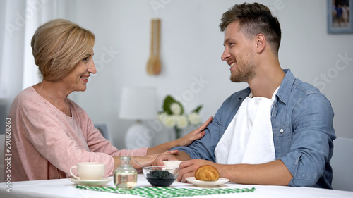 Fotografie Mother admiring adult son, long-awaited meeting, spending time together concept