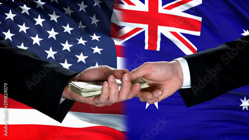 Wallpaper Mural USA and Australia officials exchanging money, flag background, business trade Torontodigital.ca