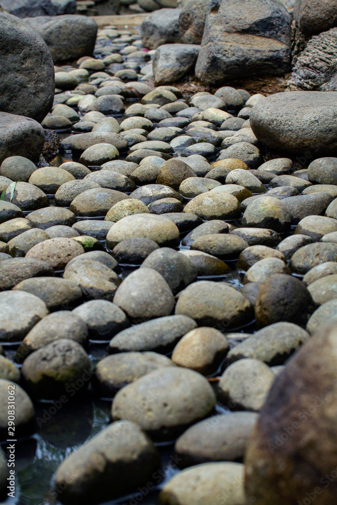 Beautiful naturally rounded stones in the dry pond Beautiful naturally rounded stones in the dry pond