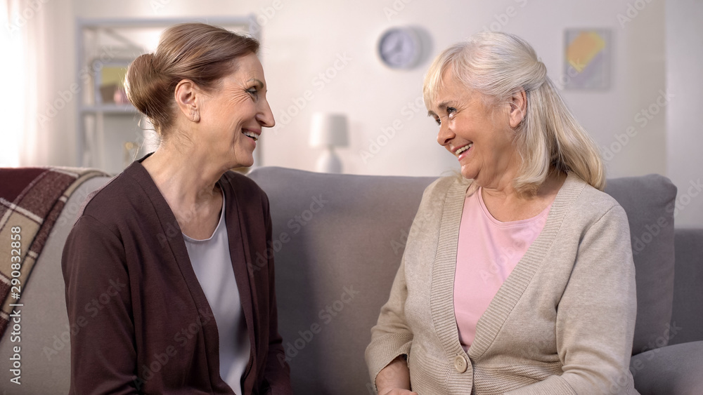 Happy female friends talking looking each other, old friendship connection, fun Happy female friends talking looking each other, old friendship connection, fun