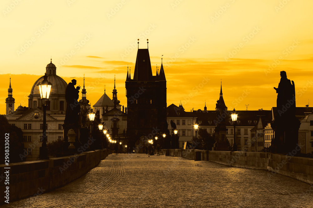 Charles Bridge Karluv Most and Old Town Tower at amazing sunrise in Prague, Czech Republic.