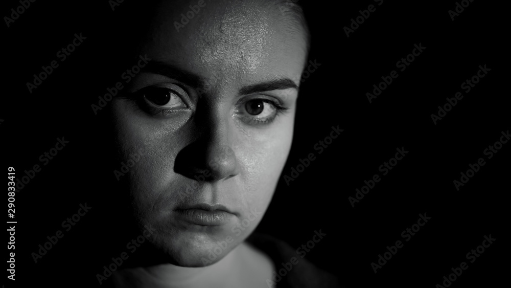 Miserable refugee looking at camera, life troubles, social insecurity, close up Miserable refugee looking at camera, life troubles, social insecurity, close up