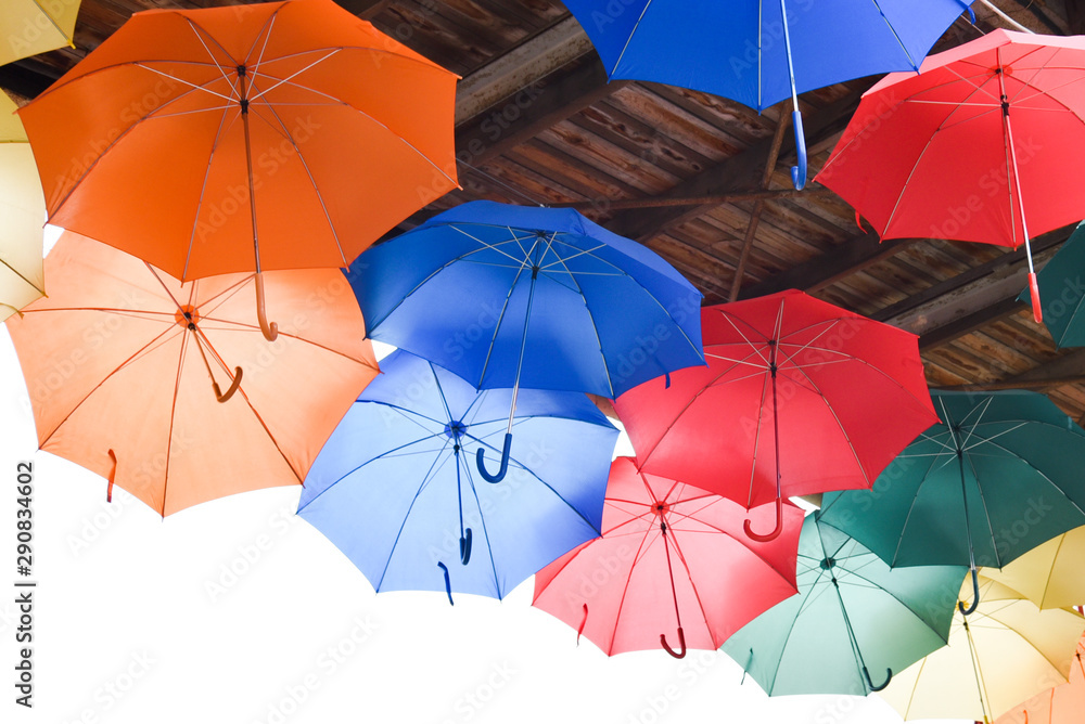 Many bright multicolored umbrellas under ceiling. fun, revelry.