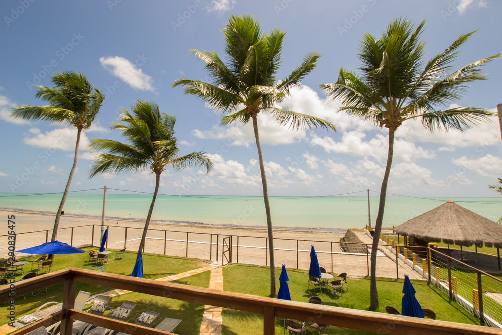 Ilha de Itamaraca, Brazil - Circa December 2018: View to a turquoise sea from the balcony of an apartment at a luxury condominium by the beach Ilha de Itamaraca, Brazil - Circa December 2018: View to a turquoise sea from the balcony of an apartment at a luxury condominium by the beach