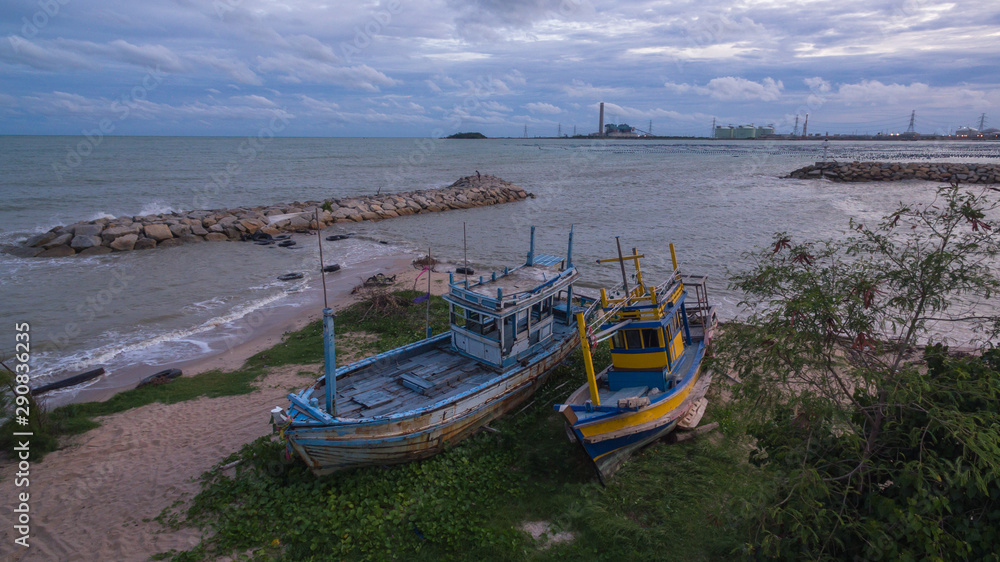 aerial view the two old fishing boats on Suchada beach close the power plant