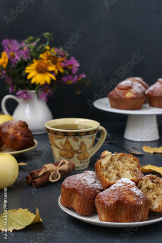 Muffins with apples and nuts on a dark background, vertical orientation, Autumn composition