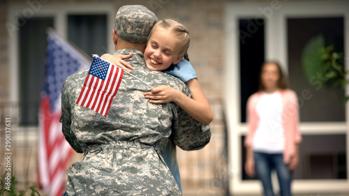 Принти на полотні Cheerful daughter hugging father soldier, long awaited meeting, homecome