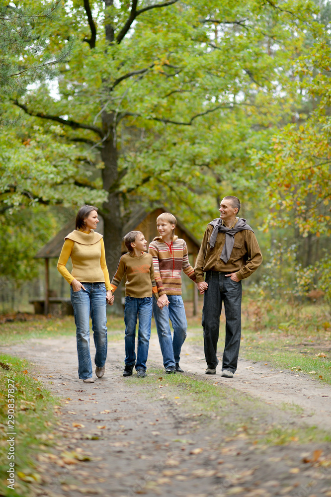 Portrait of family of four in park Portrait of family of four in park