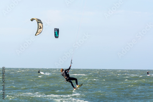 Water sport event, kite surfers race in North Sea near Renesse, Zeeland, Netherlands