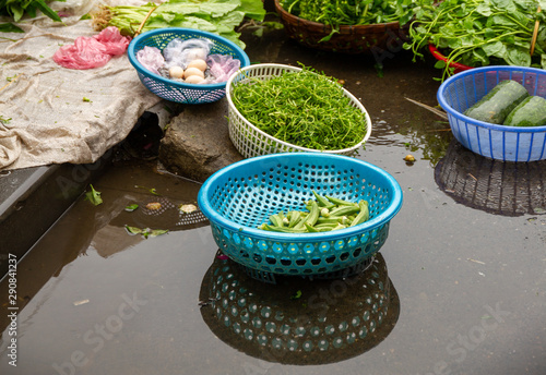 Baskets of food on ground, Hoi An Market, Vietnam