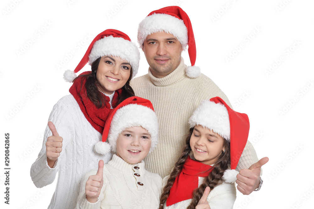 Portrait of family with kids in santa hats Portrait of family with kids in santa hats
