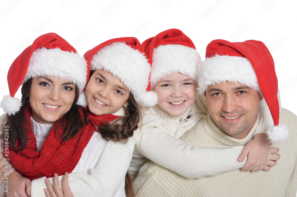 Portrait of family with kids in santa hats Portrait of family with kids in santa hats