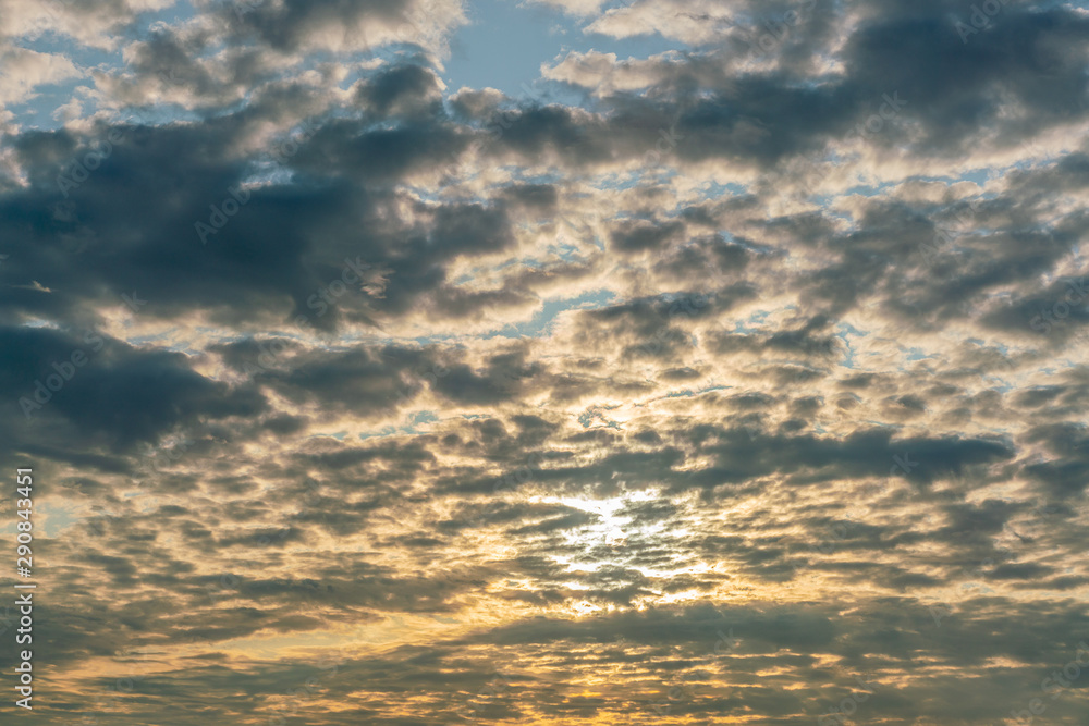 Obraz premium Mystical sky with dark clouds at sunset. Very beautiful evening time. Golden hour.
