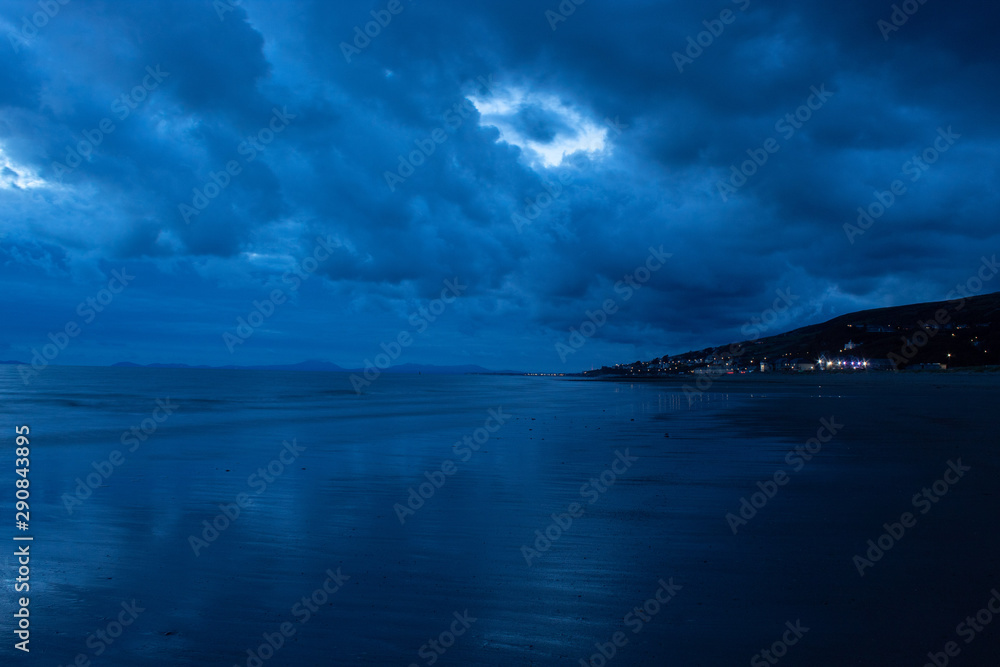 Lightened town next to beach