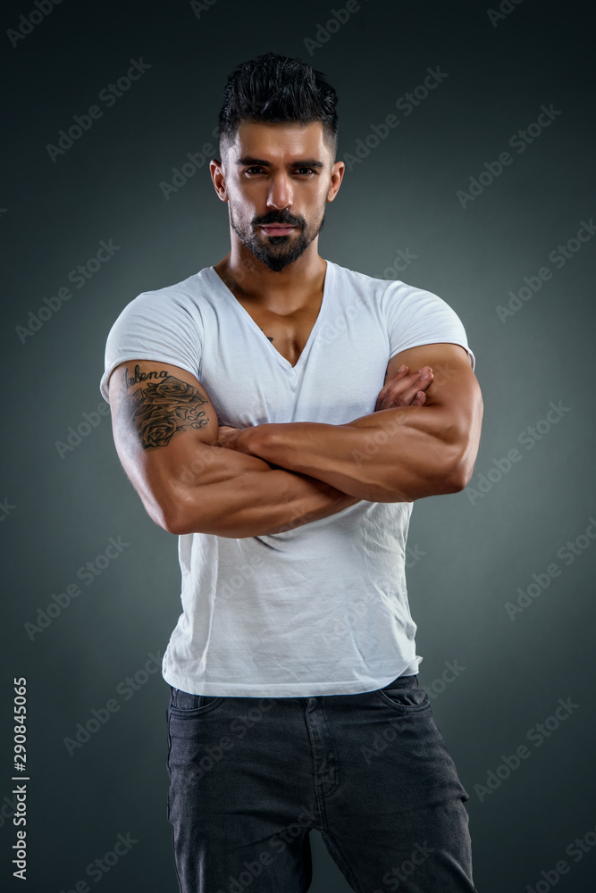 Handsome Male Fitness Model Wearing Jeans and White T-Shirts Stock ...