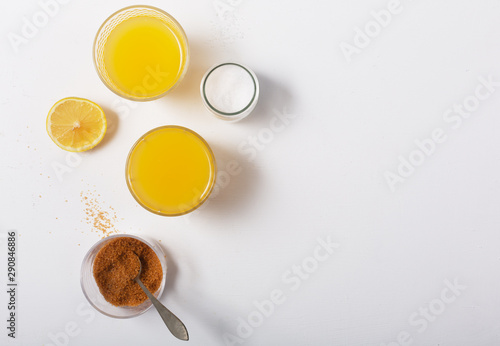 Homemade Isotonic Energy Drink and Ingredients. Glasses With Yellow Liquid, Homemade Sport Beverage, horizontal orientation