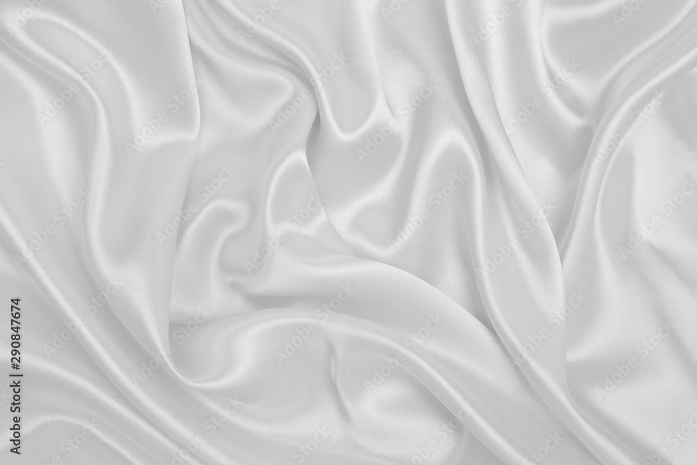 Smooth elegant white silk or satin luxury cloth texture as wedding background. Luxurious background design Smooth elegant white silk or satin luxury cloth texture as wedding background. Luxurious background design