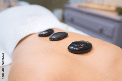 hot stone on back womans