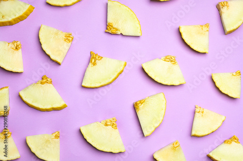 Flat lay composition with tasty melon on violet background