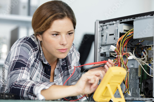 Wallpaper Mural young woman fix pc component in service center Torontodigital.ca