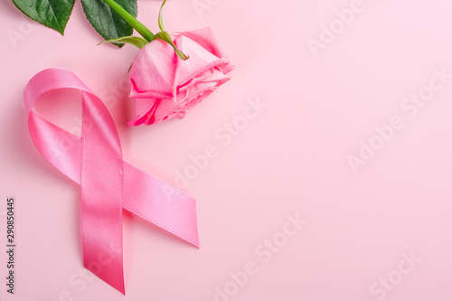 Pink ribbon and rose on a pink background. Breast Cancer Awareness Month