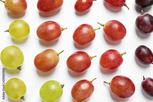 Fresh ripe juicy grapes on white background, top view