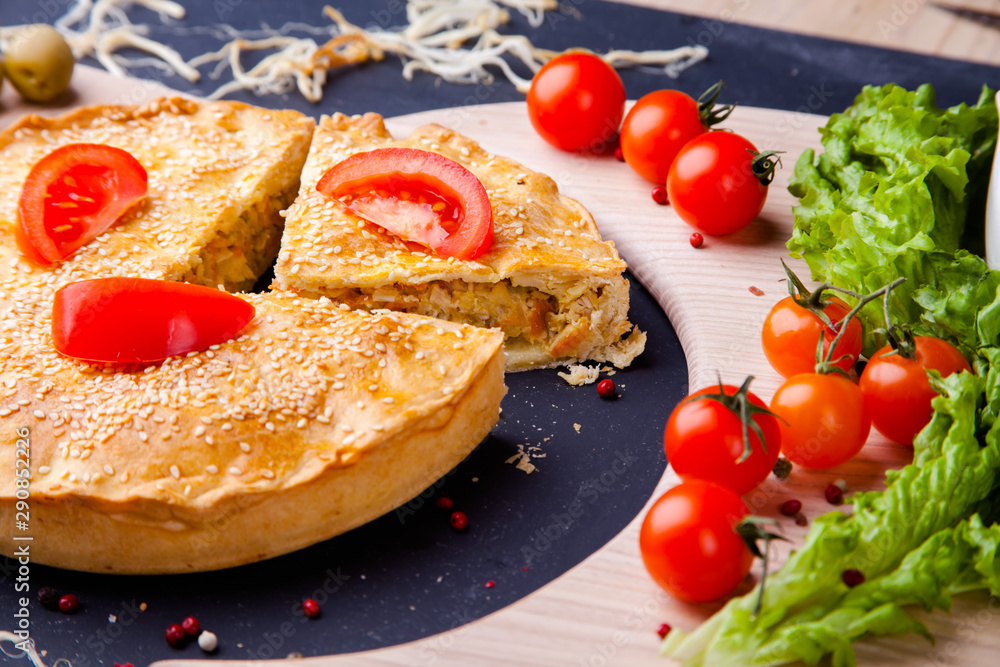 Fresh Traditional Australian meat mini pie on the wooden board on table background, closeup with copy space, top view, rustic style Fresh Traditional Australian meat mini pie on the wooden board on table background, closeup with copy space, top view, rustic style