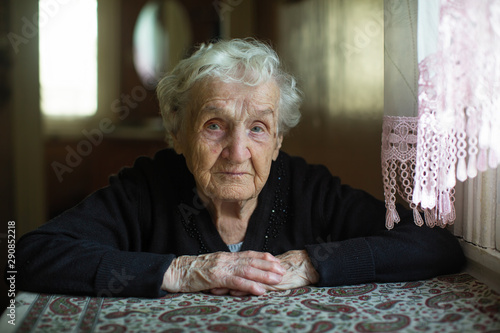 Portrait of an old gray-haired woman.