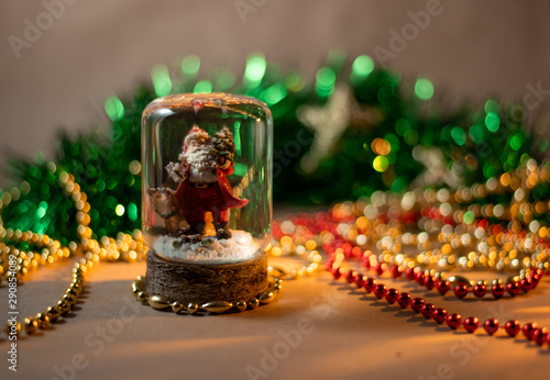 Santa Claus in a glass ball. Christmas mood. Greeting card.