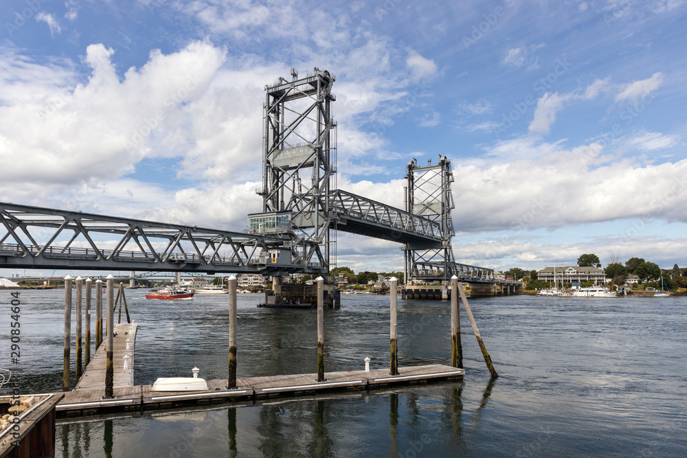 Vertical-lift bridge in raised position over fast flowing Piscataqua River Vertical-lift bridge in raised position over fast flowing Piscataqua River