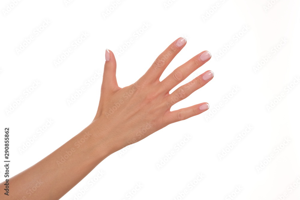 Female hand showing five fingers.