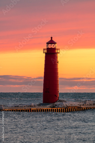 lighthouse at sunset with pastel colors