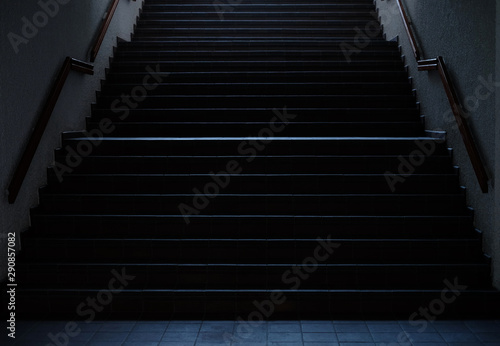 Dark empty obscure staircase, dark tone image.
