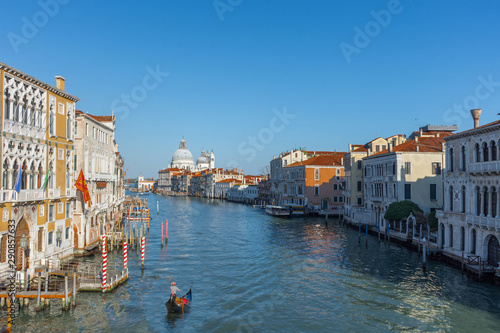  Beautiful Venetian view with Grand Canal, Basilica Santa Maria della Salute and traditional gondolas, in Venice, Italy © Aron M  - Austria