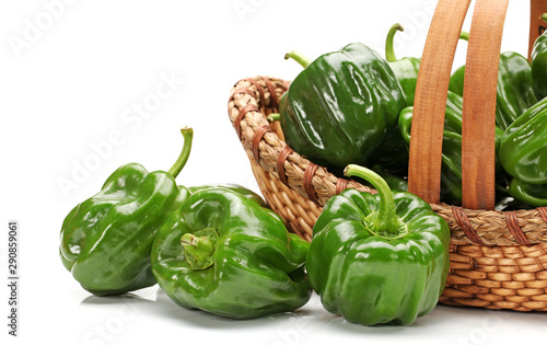 Fresh green bell pepper capsicum on a white background
