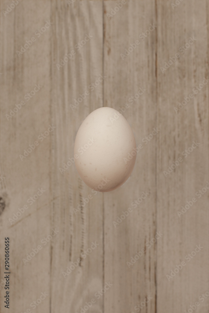 isolate egg on grey wooden background isolate egg on grey wooden background