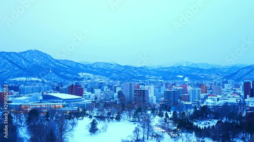 Sunset Timelapse of Sapporo City, Hokkaido Island, Japan, Famous Ski Resort and Host of Winter Olympic Games photo