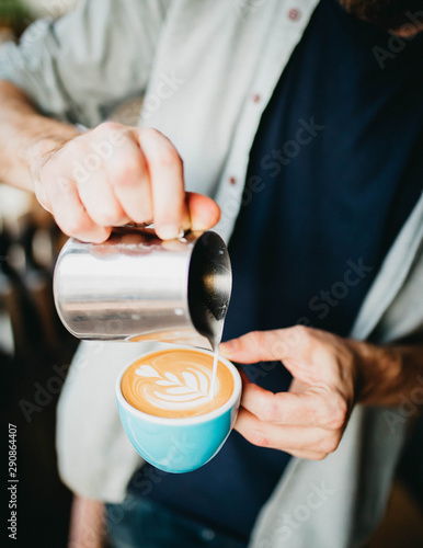 man pouring a cup of coffee